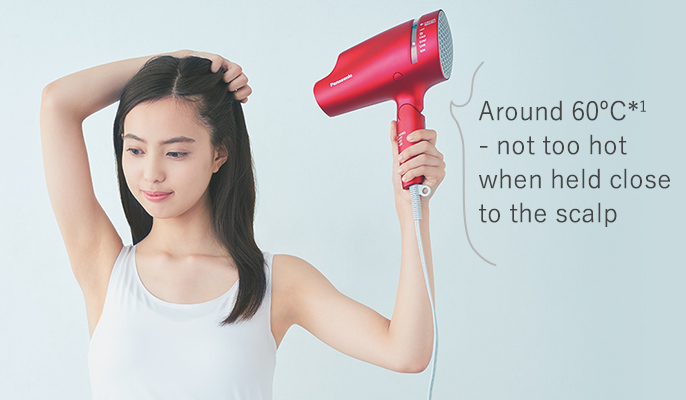 Around 60ºC - not too hot when held close to the scalp